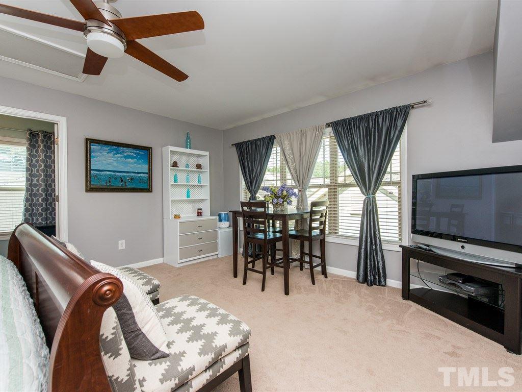 1310 Rodessa Run Raleigh, NC 27607 - Photo 21 of 25 a view of a livingroom with furniture and a flat screen tv