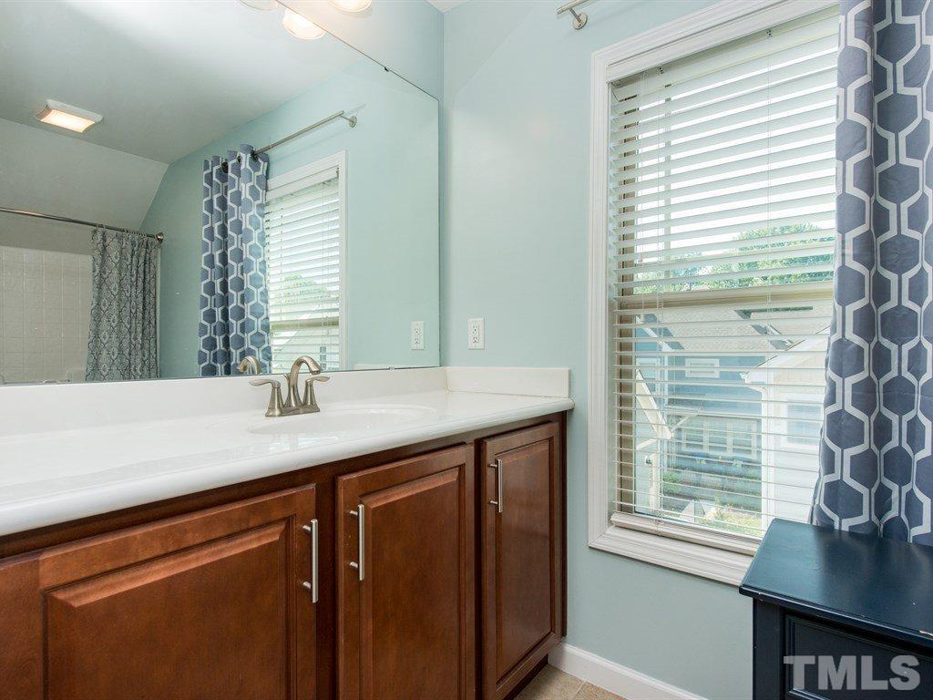 1310 Rodessa Run Raleigh, NC 27607 - Photo 22 of 25 a kitchen with a sink and a window
