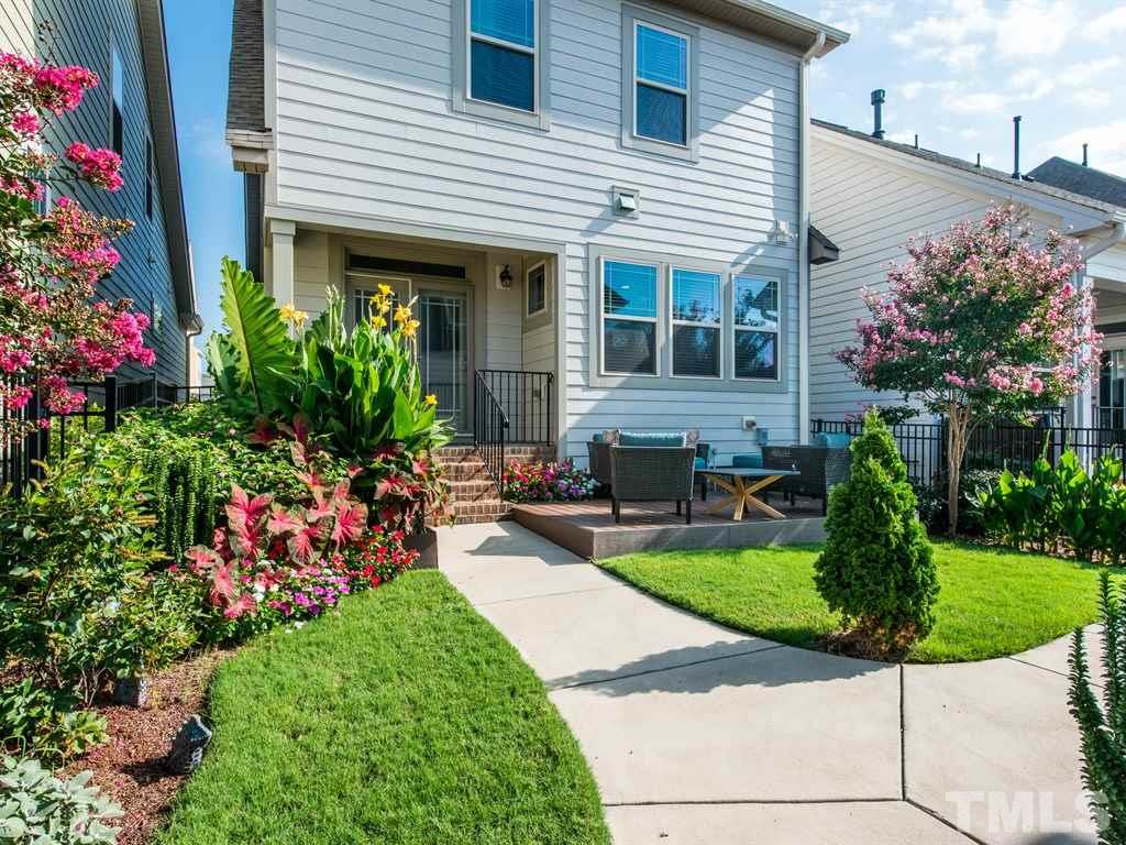1310 Rodessa Run Raleigh, NC 27607 - Photo 23 of 25 a front view of a house with garden and plants