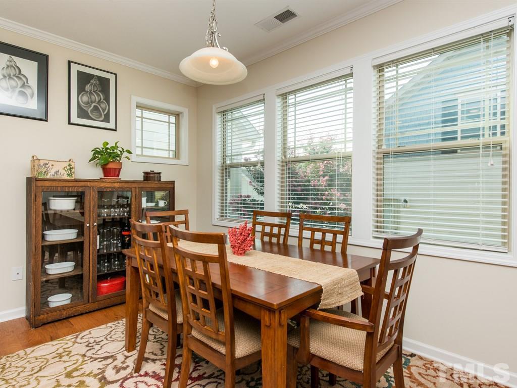 1310 Rodessa Run Raleigh, NC 27607 - Photo 6 of 25 a view of a dining room with furniture and window