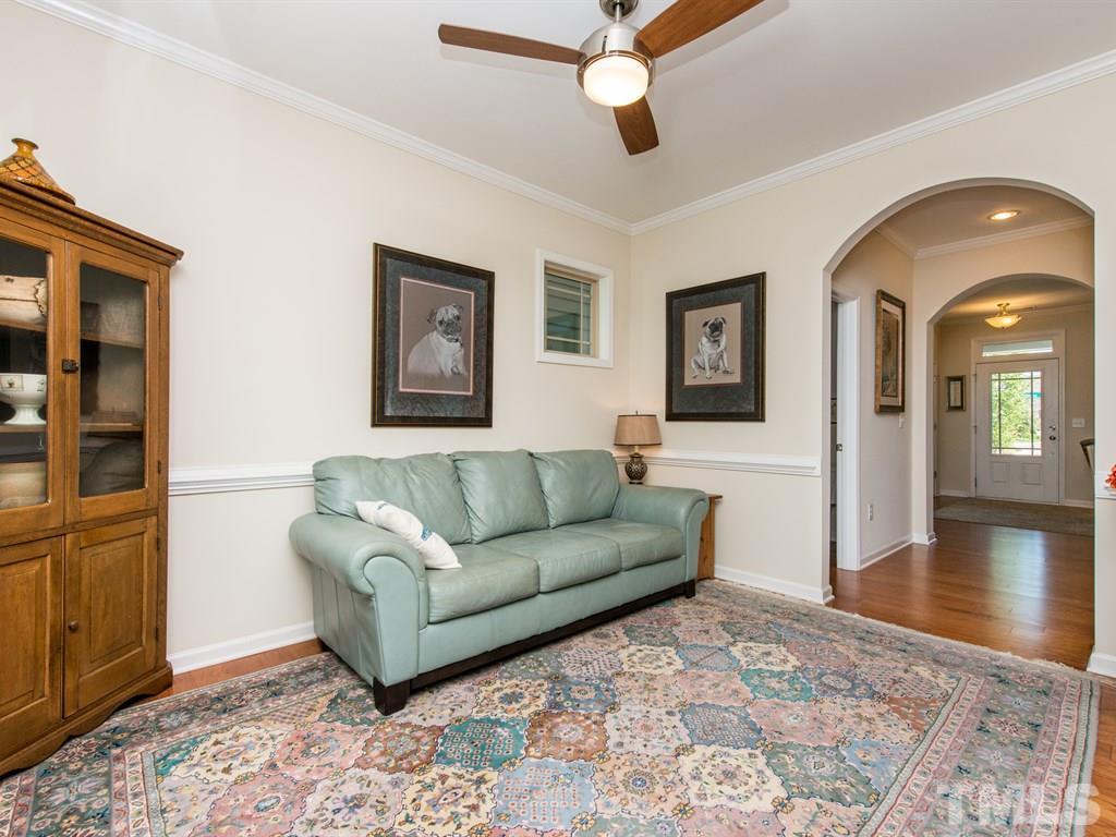 1310 Rodessa Run Raleigh, NC 27607 - Photo 7 of 25 a living room with furniture and a wooden floor