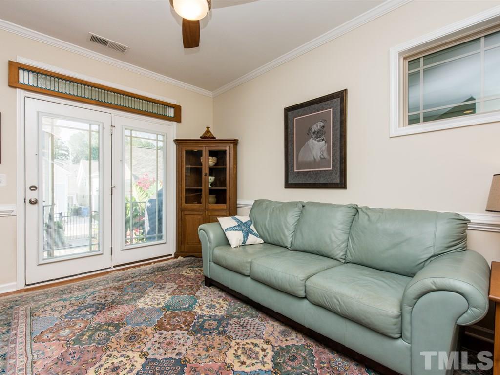1310 Rodessa Run Raleigh, NC 27607 - Photo 8 of 25 a living room with furniture and a large window