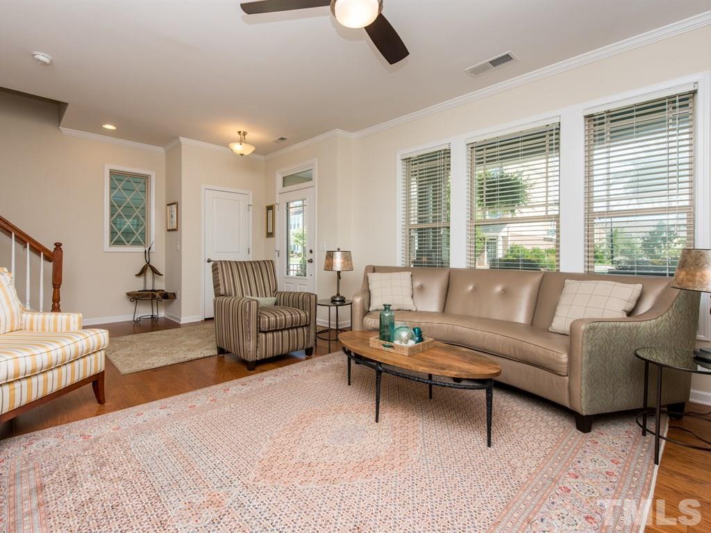 1310 Rodessa Run Raleigh, NC 27607 - Photo 9 of 25 a living room with furniture and a large window