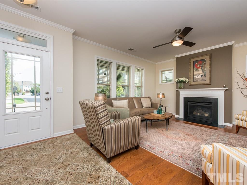 1310 Rodessa Run Raleigh, NC 27607 - Photo 10 of 25 a living room with furniture and a fireplace