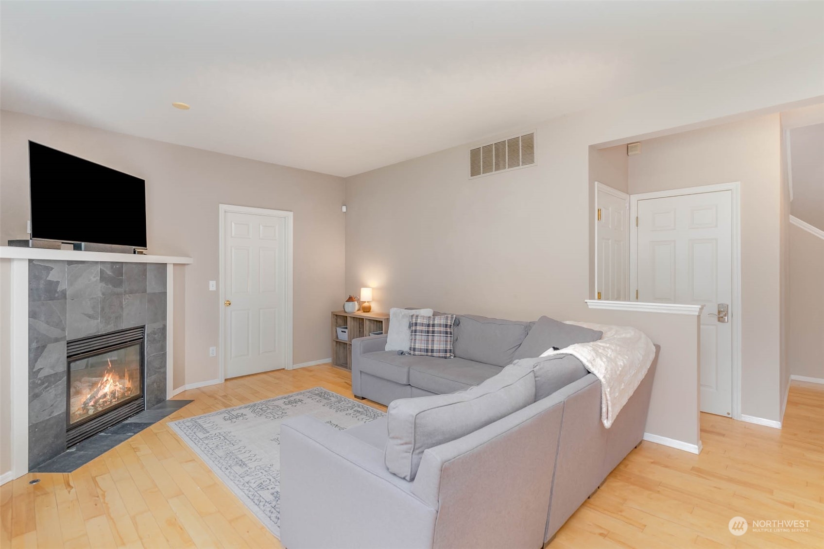 15503 Cedar Grove Road Southeast Issaquah, WA 98027 - Photo 12 of 27 a living room with furniture and a fireplace
