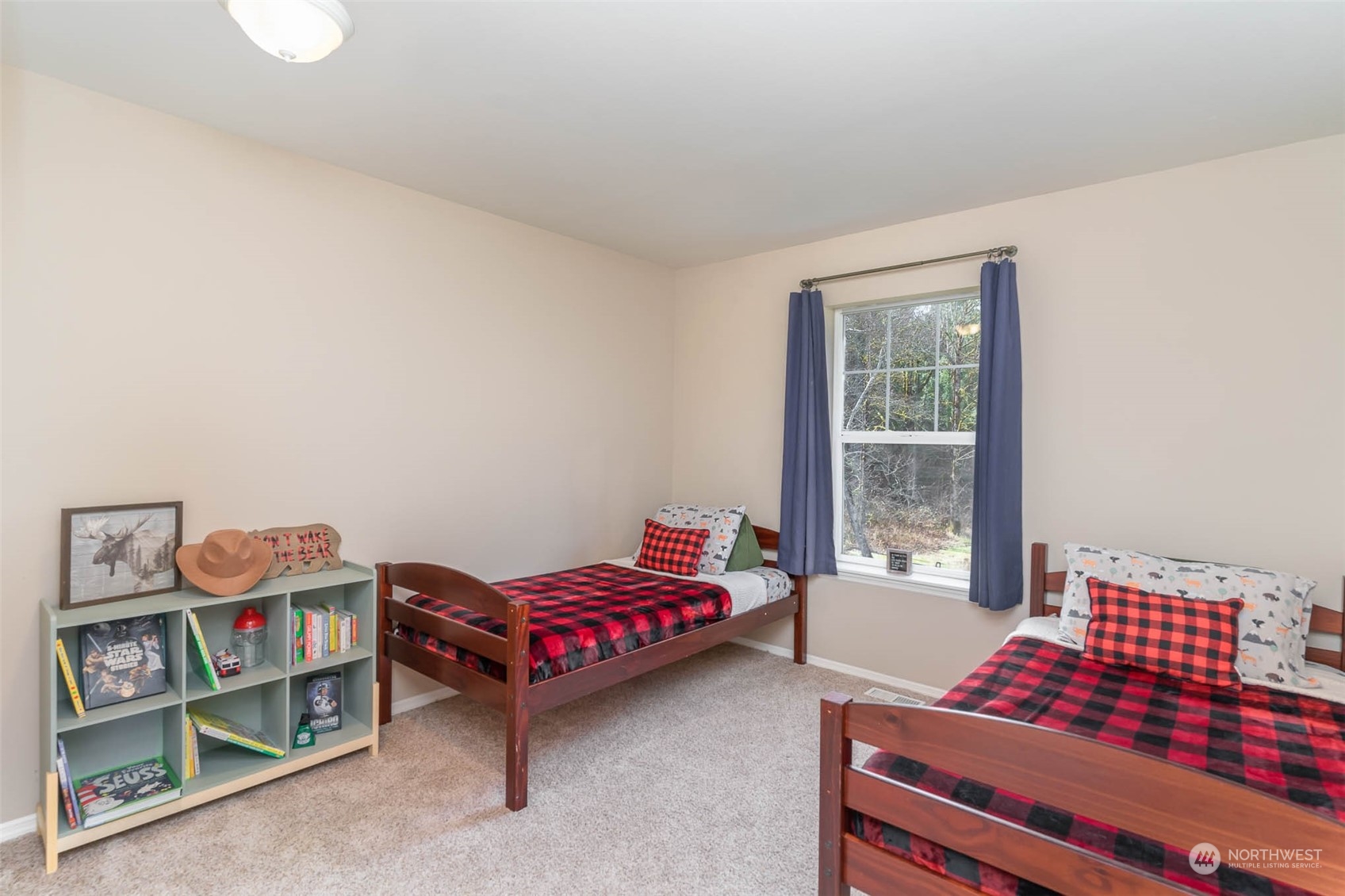 15503 Cedar Grove Road Southeast Issaquah, WA 98027 - Photo 18 of 27 a bedroom with furniture and a window