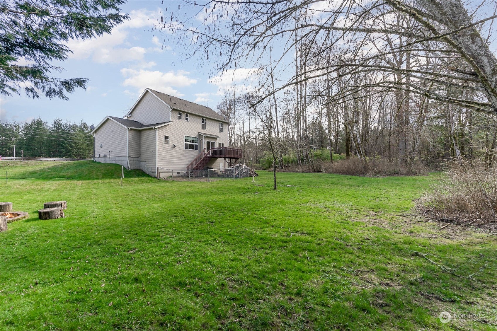 15503 Cedar Grove Road Southeast Issaquah, WA 98027 - Photo 26 of 27 a view of a house with a yard and sitting area