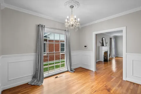 a view of livingroom with hallway and wooden floor