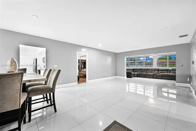 a large white room with a large window