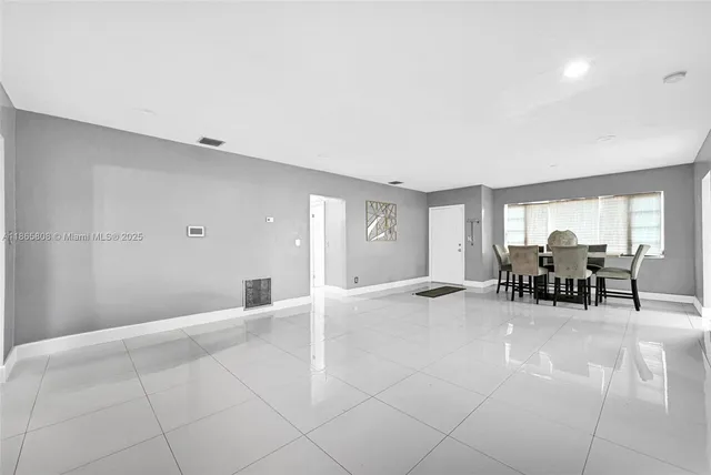 a view of a livingroom with furniture and window