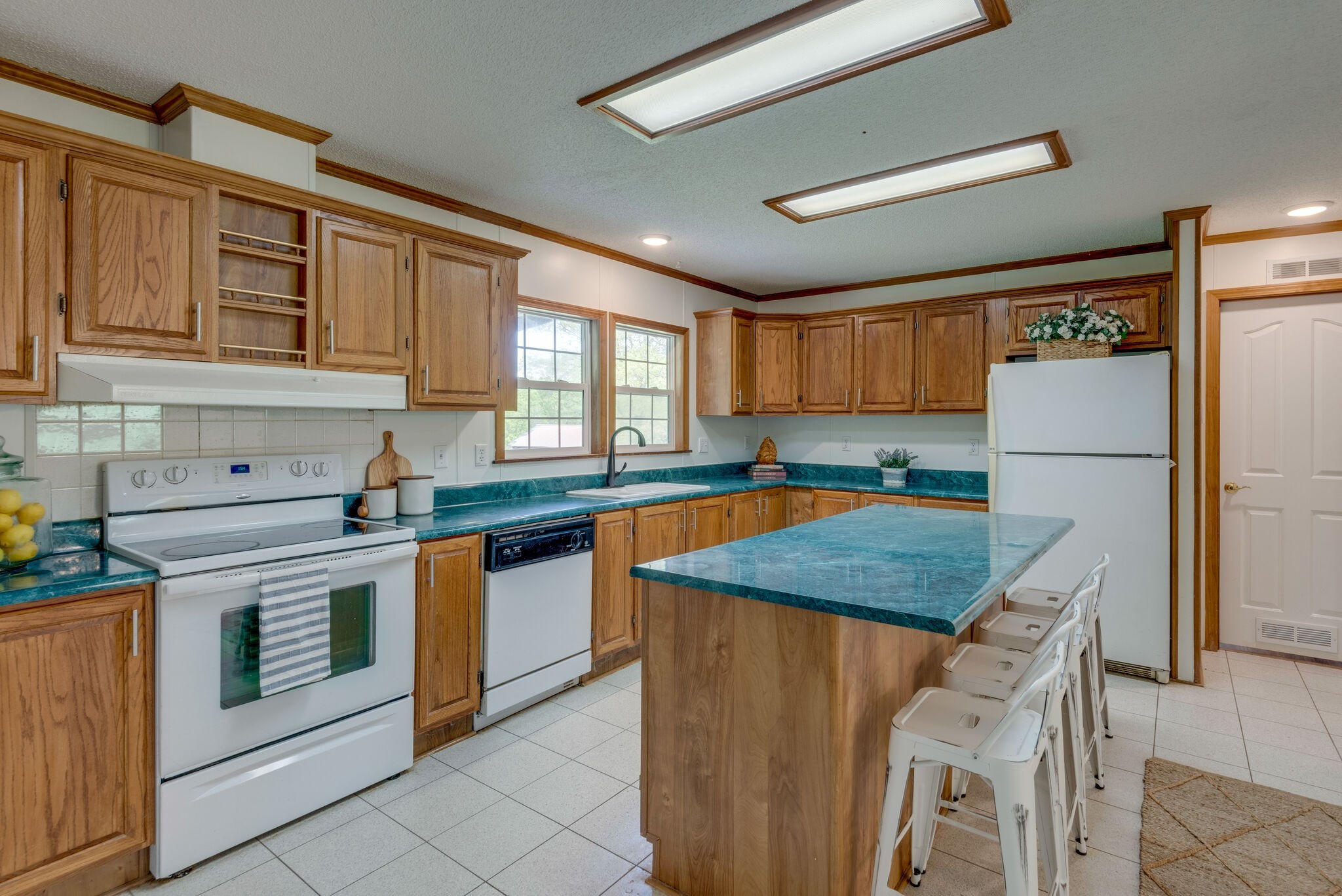 7289 Anderson Road Fairview, TN 37062 - Photo 21 of 51 a kitchen with stainless steel appliances granite countertop refrigerator sink and cabinets