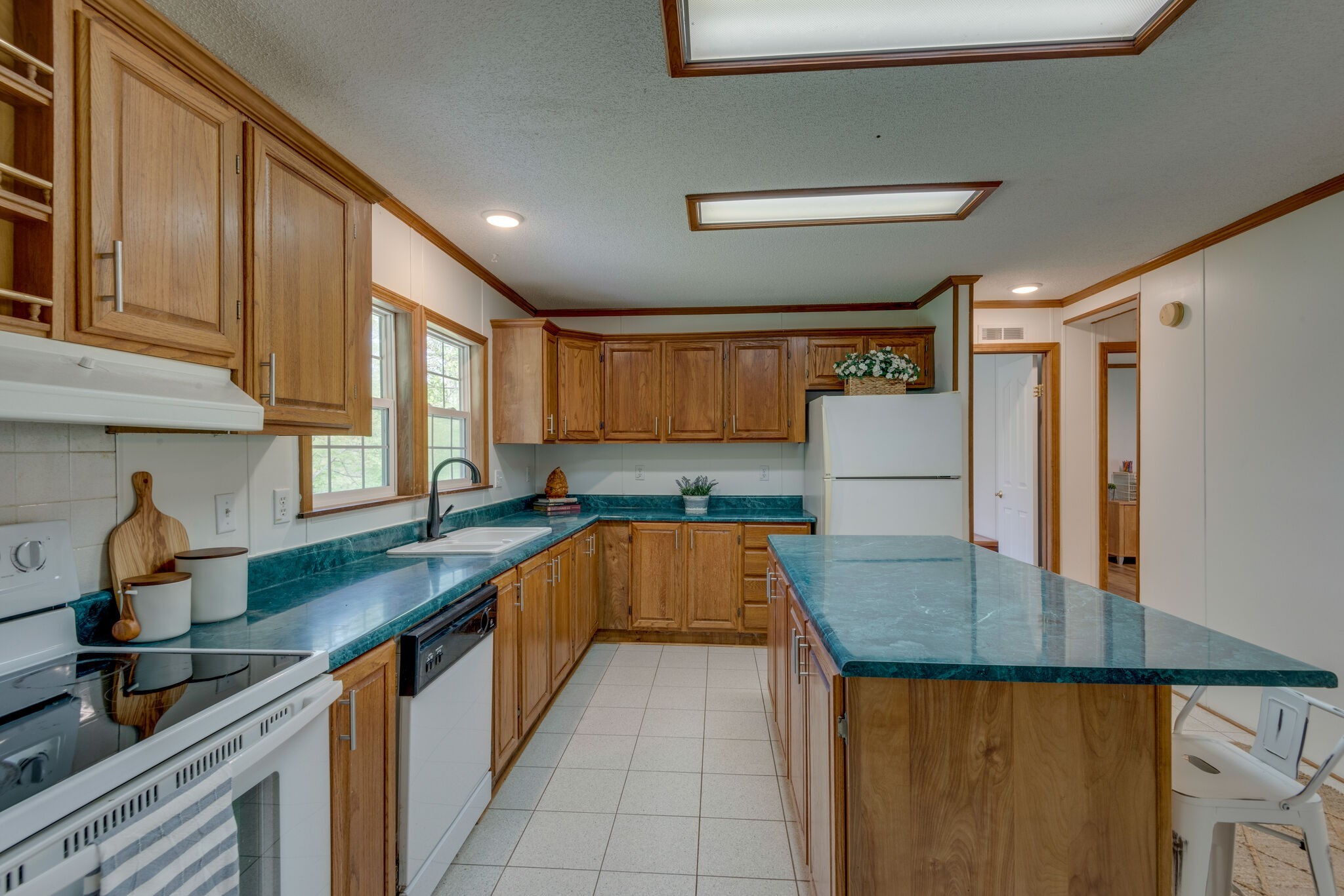 7289 Anderson Road Fairview, TN 37062 - Photo 22 of 51 a kitchen with stainless steel appliances granite countertop a sink refrigerator and cabinets