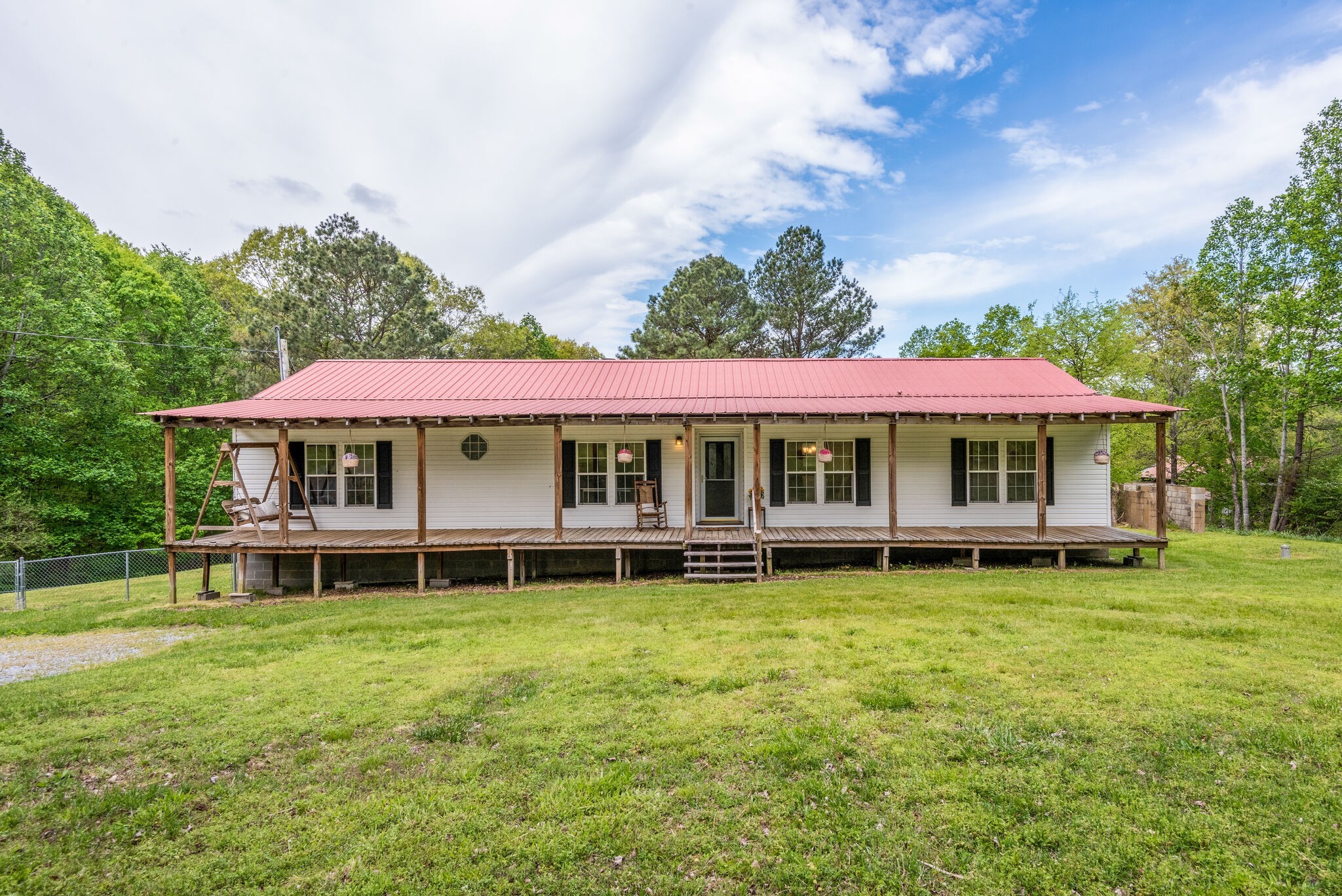 7289 Anderson Road Fairview, TN 37062 - Photo 8 of 51 a front view of a house with a garden and deck