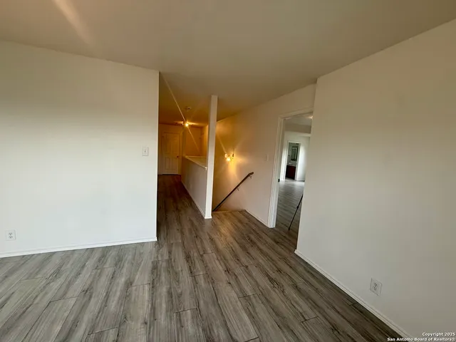a view of a livingroom with wooden floor