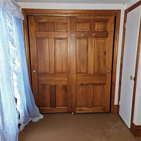 an entryway with wooden floor