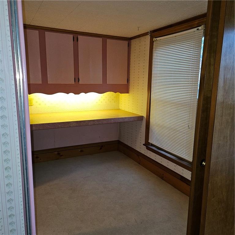 111 Laughlin Street Dawson, PA 15428 - Photo 17 of 21 a view of a room with an empty space and a window