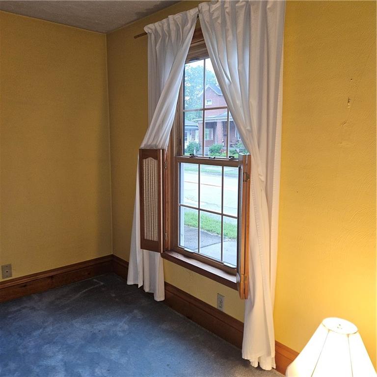 111 Laughlin Street Dawson, PA 15428 - Photo 5 of 21 a view of an empty room with a window