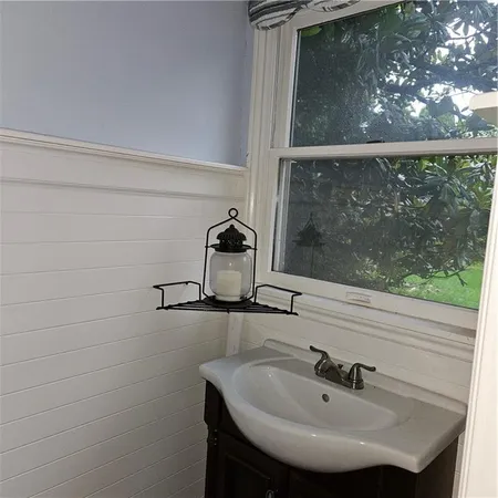 a bathroom with a sink and mirror