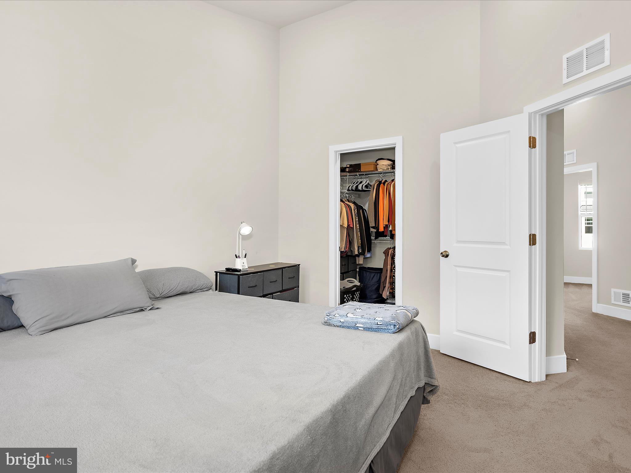2324 Woodlands Road Baltimore, MD 21244 - Photo 17 of 44 a bedroom with a bed and a walk in closet