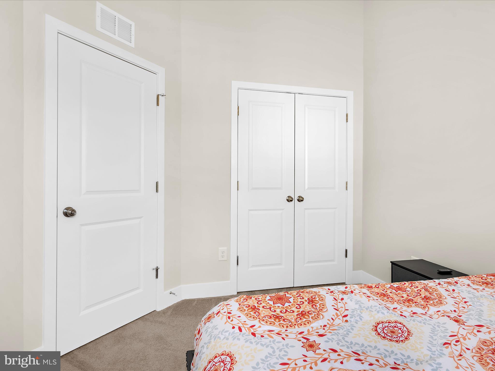 2324 Woodlands Road Baltimore, MD 21244 - Photo 19 of 44 a bedroom with a bed and a rug