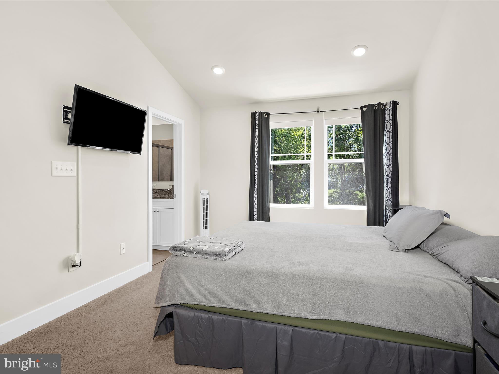2324 Woodlands Road Baltimore, MD 21244 - Photo 21 of 44 a bedroom with a bed tv and window