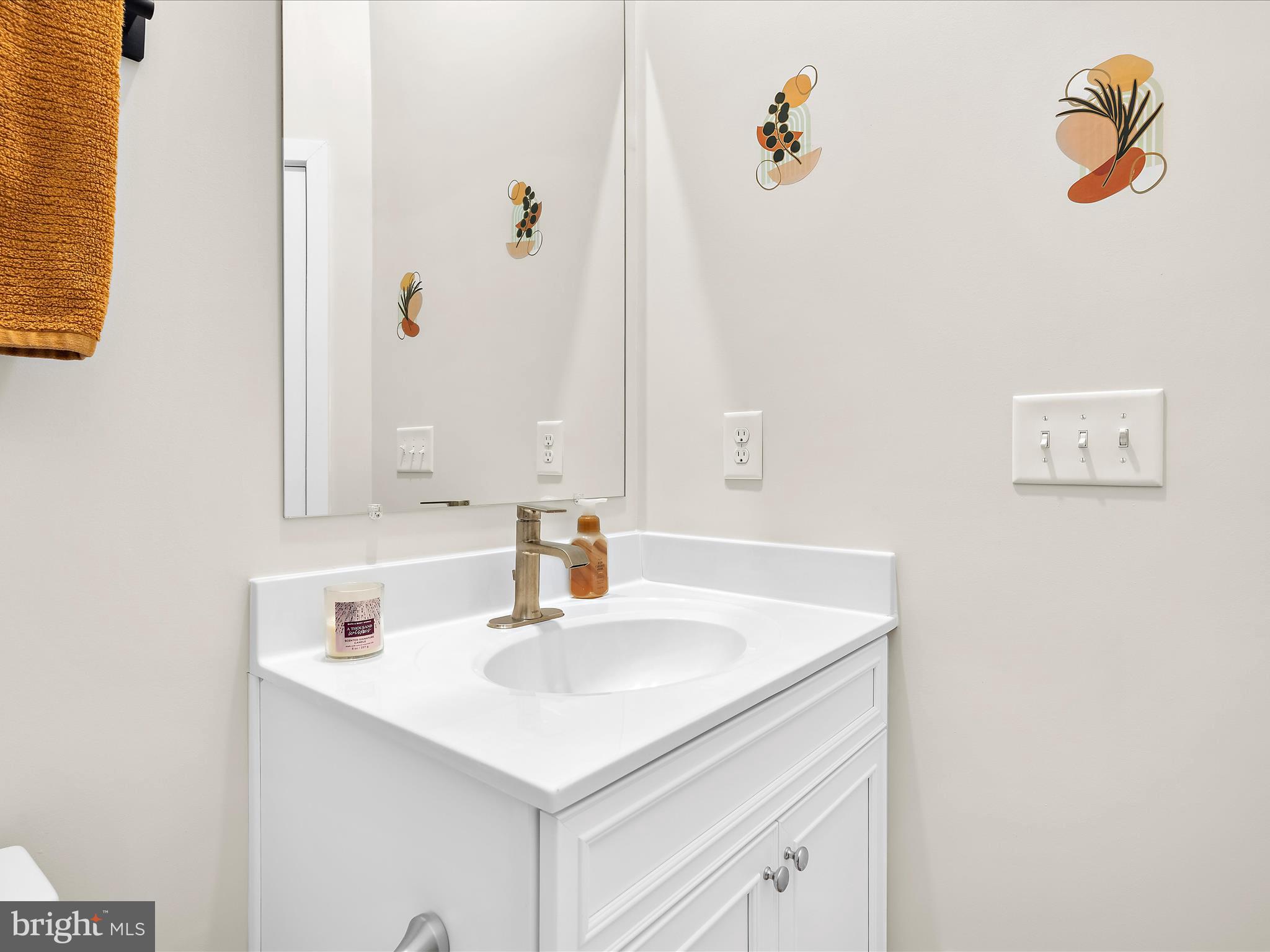 2324 Woodlands Road Baltimore, MD 21244 - Photo 23 of 44 a bathroom with a sink vanity and a mirror