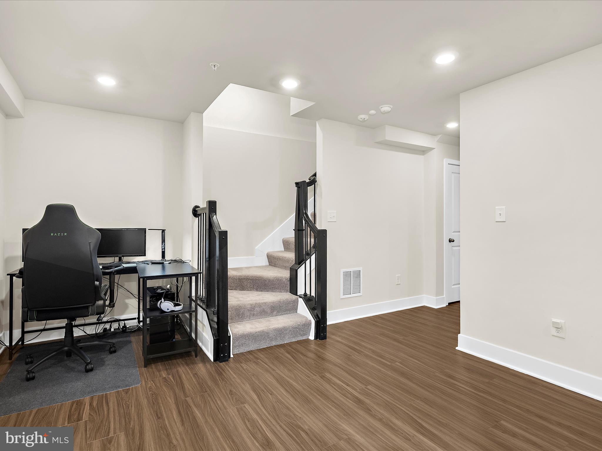2324 Woodlands Road Baltimore, MD 21244 - Photo 25 of 44 a view of a workspace with furniture and wooden floor