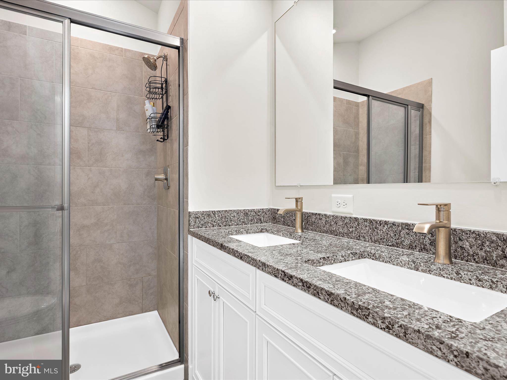 2324 Woodlands Road Baltimore, MD 21244 - Photo 27 of 44 a bathroom with a granite countertop sink and mirror