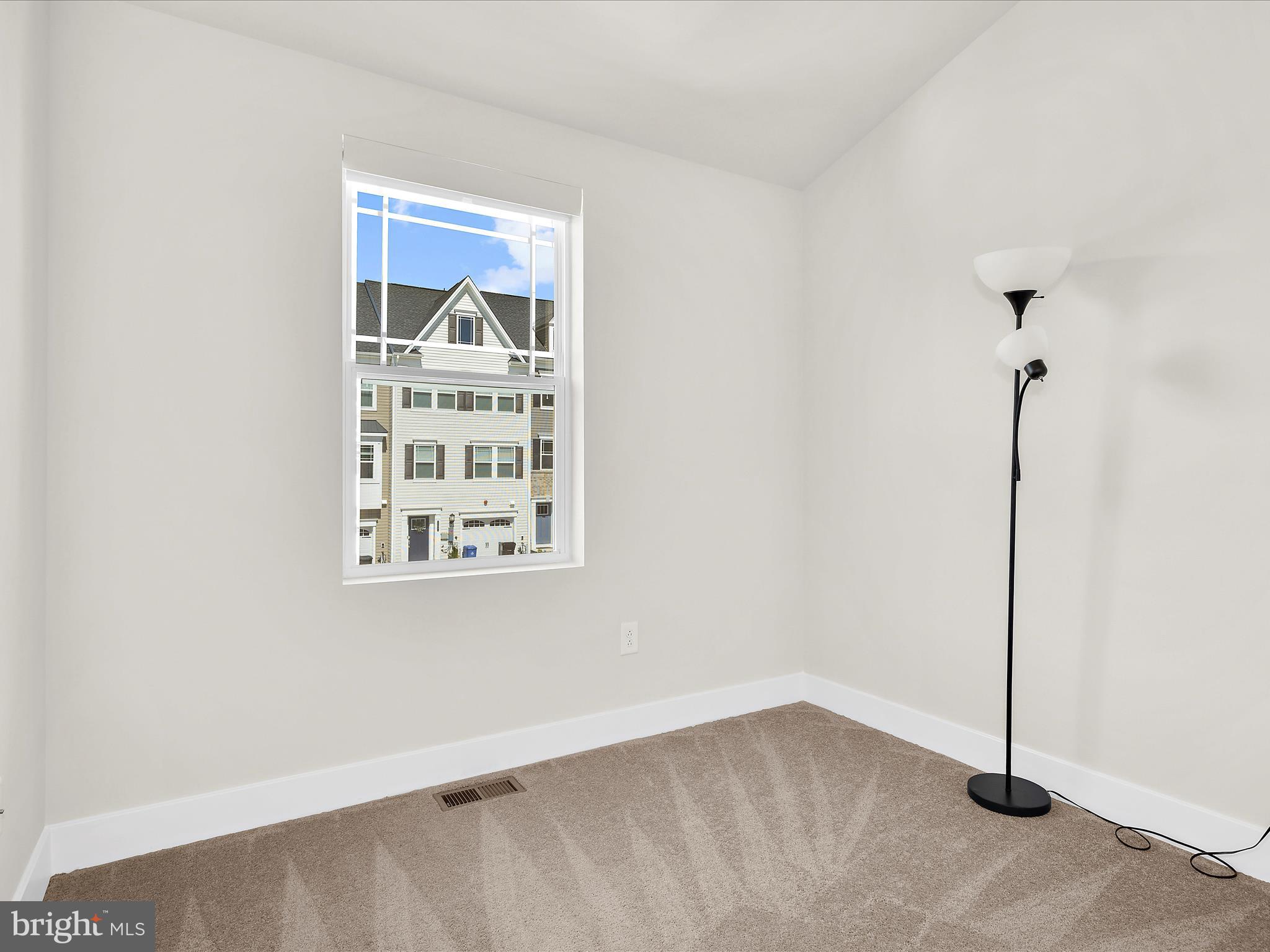 2324 Woodlands Road Baltimore, MD 21244 - Photo 28 of 44 a view of an empty room with a window