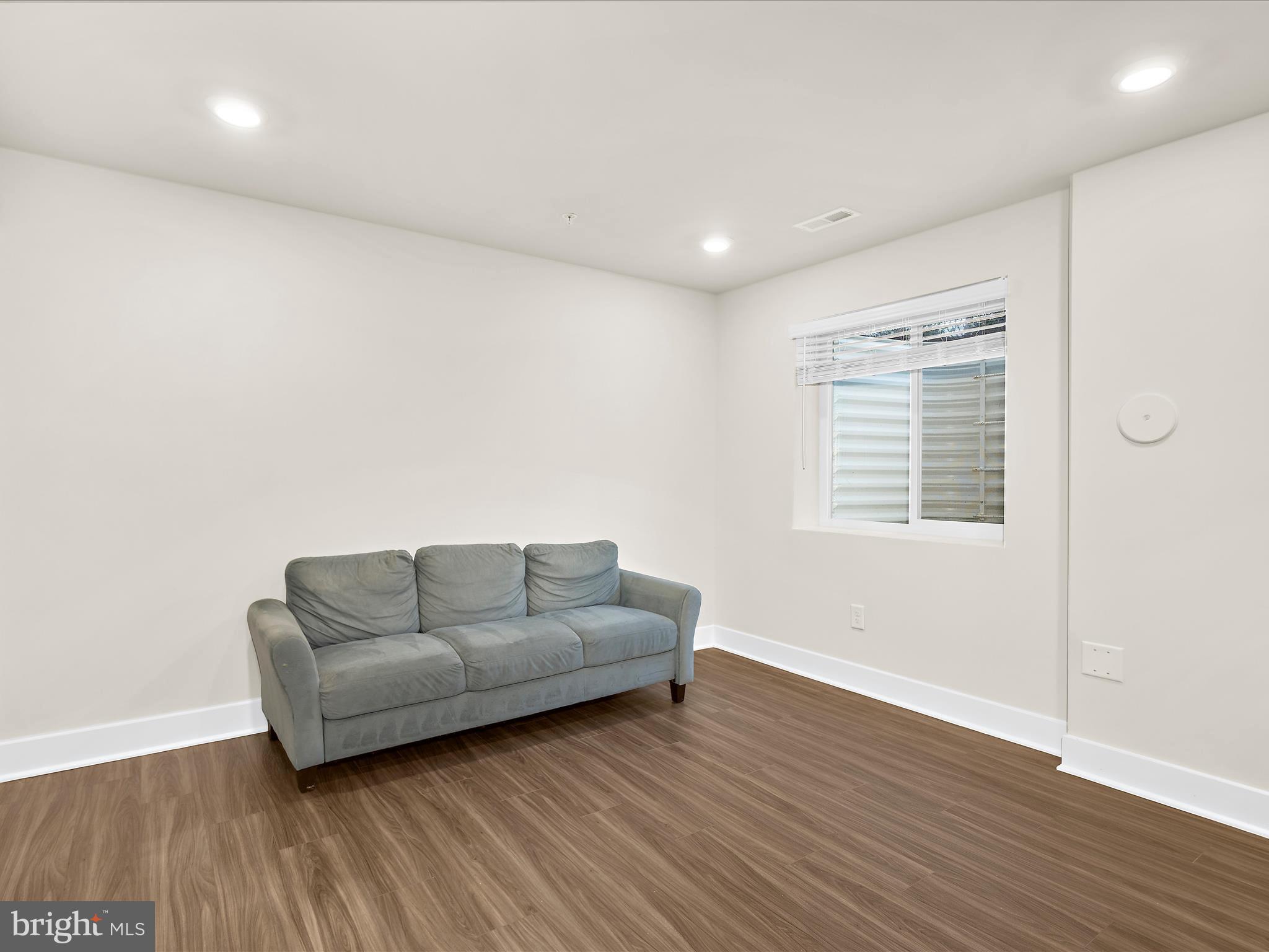 2324 Woodlands Road Baltimore, MD 21244 - Photo 30 of 44 a living room with furniture and a wooden floor