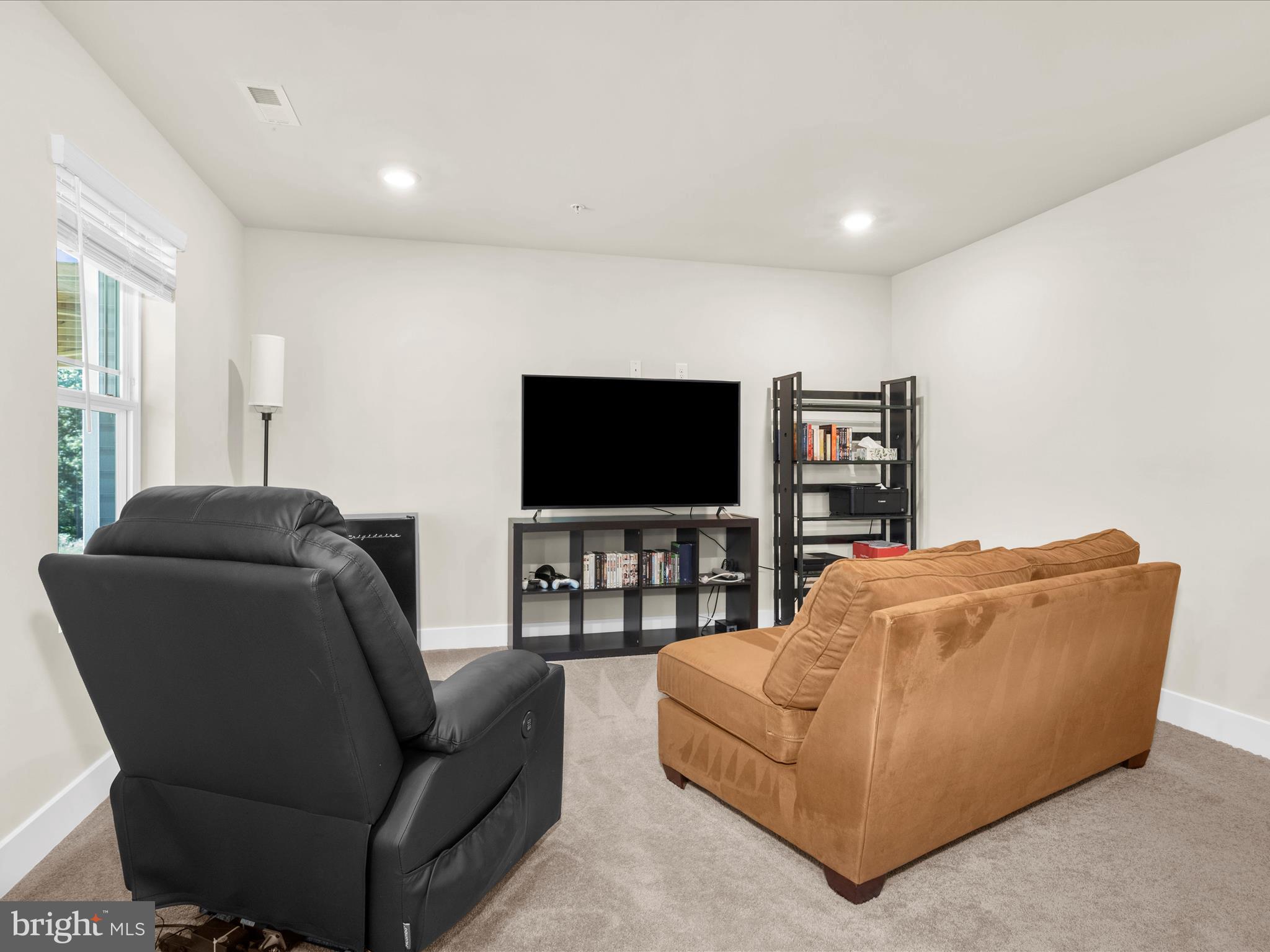 2324 Woodlands Road Baltimore, MD 21244 - Photo 32 of 44 a living room with furniture and a flat screen tv