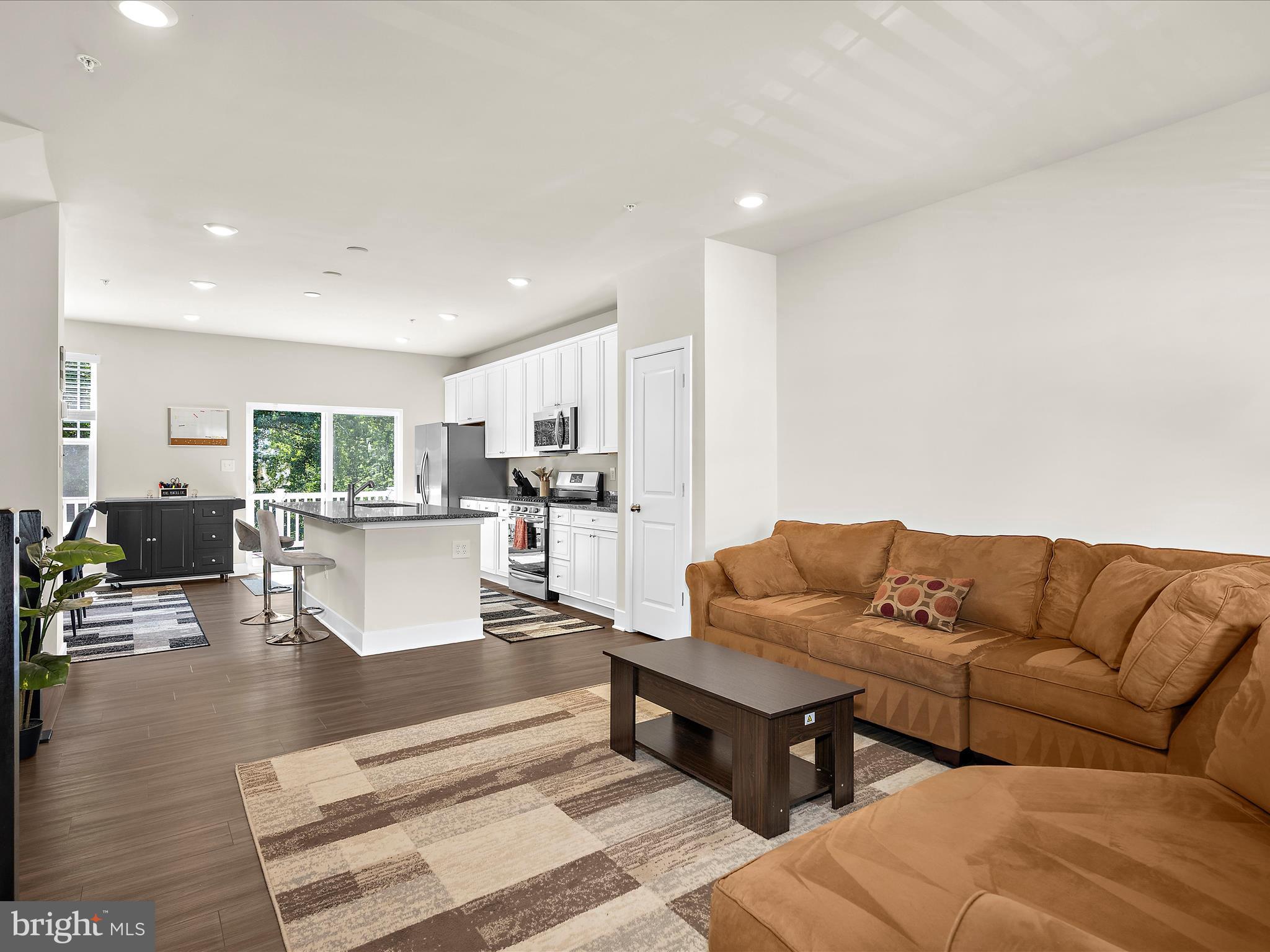 2324 Woodlands Road Baltimore, MD 21244 - Photo 7 of 44 a living room with furniture and kitchen view