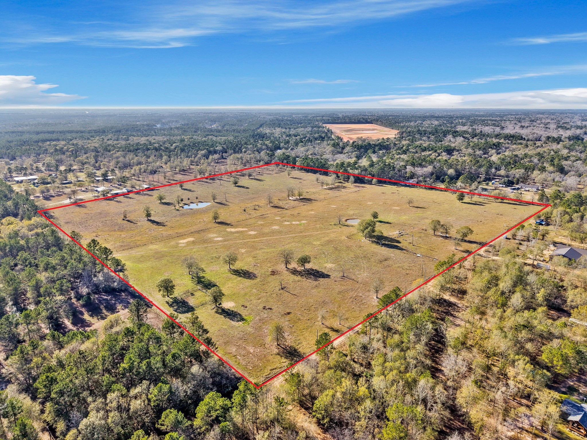 9789 North Walker Road Cleveland, TX 77328 - Photo 8 of 10 Existing homes nearby provide context for development potential while preserving the peaceful, rural character of the area.
