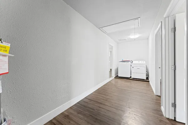 a view of a storage & utility room with wooden floor