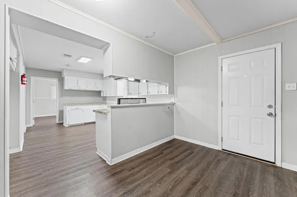 a view of kitchen with wooden floor