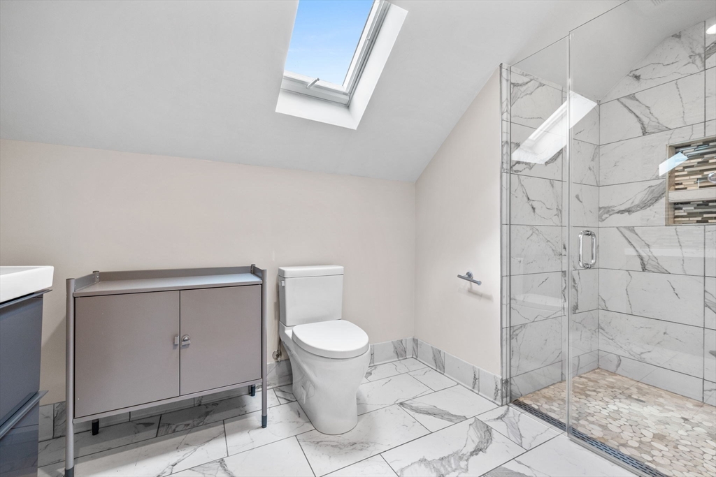 582 High Street, Unit 2 Medford, MA 02155 - Photo 16 of 27 a bathroom with a toilet and a shower