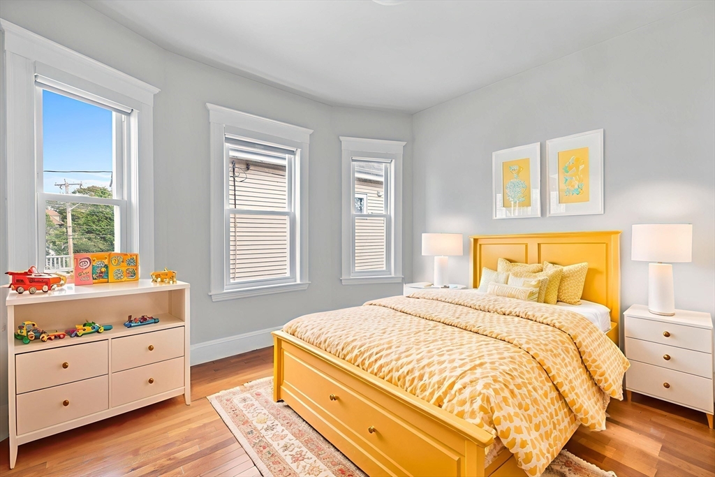 582 High Street, Unit 2 Medford, MA 02155 - Photo 20 of 27 a bedroom with a bed and window