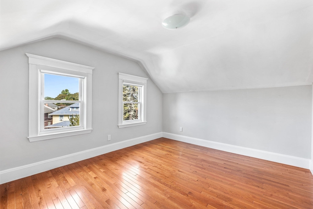 582 High Street, Unit 2 Medford, MA 02155 - Photo 23 of 27 a view of empty room with wooden floor and fan