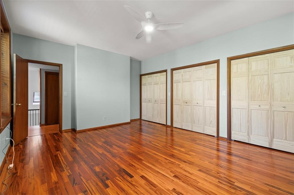 6109 Fifth Avenue, Unit 2 Pittsburgh, PA 15232 - Photo 20 of 31 a view of an empty room with wooden floor and a window