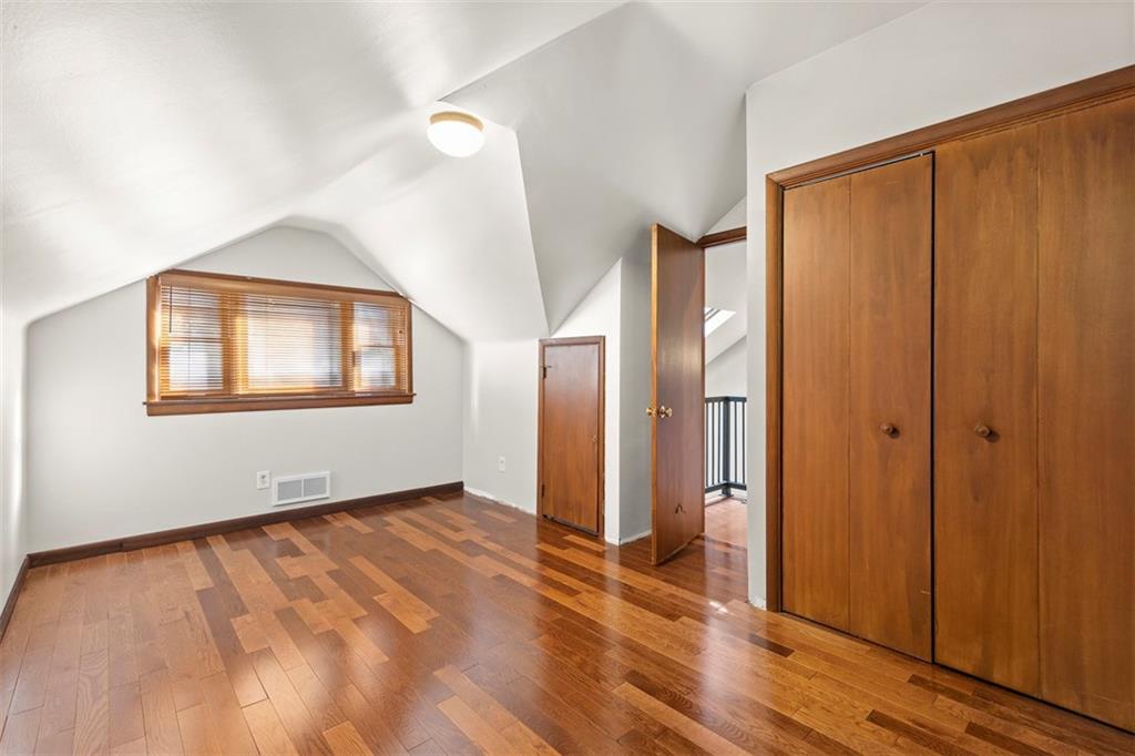 6109 Fifth Avenue, Unit 2 Pittsburgh, PA 15232 - Photo 22 of 31 a view of an empty room with wooden floor and a window