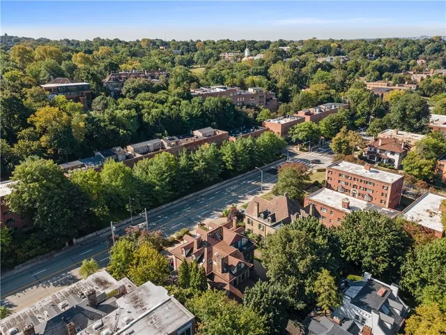 an aerial view of a house with a lake view