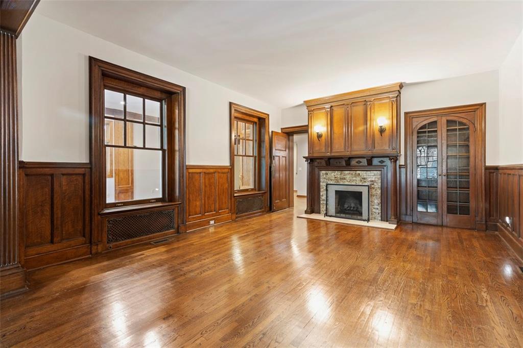 6109 Fifth Avenue, Unit 2 Pittsburgh, PA 15232 - Photo 7 of 31 a view of a livingroom with a fireplace window and wooden floor