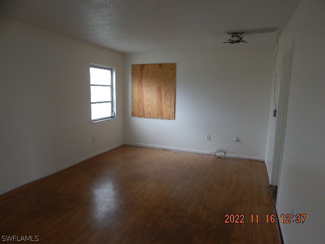 37531 Washington Loop Road Punta Gorda, FL 33982 - Photo 5 of 16 an empty room with a window