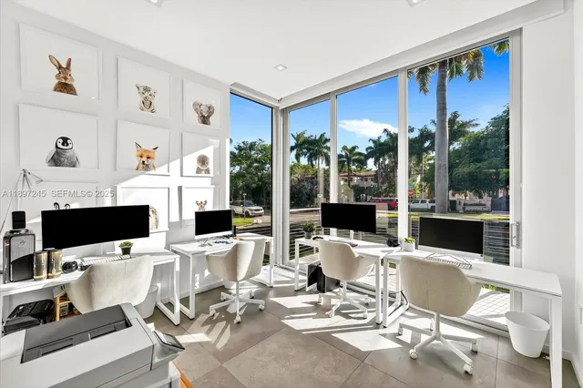 a outdoor space with furniture a large window and a flat screen tv