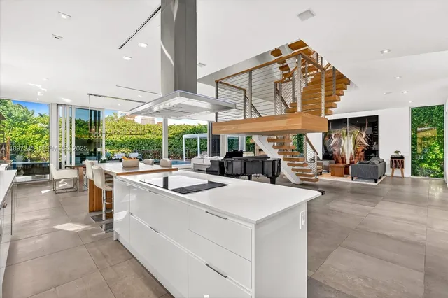 a view of a patio with dining table and chairs