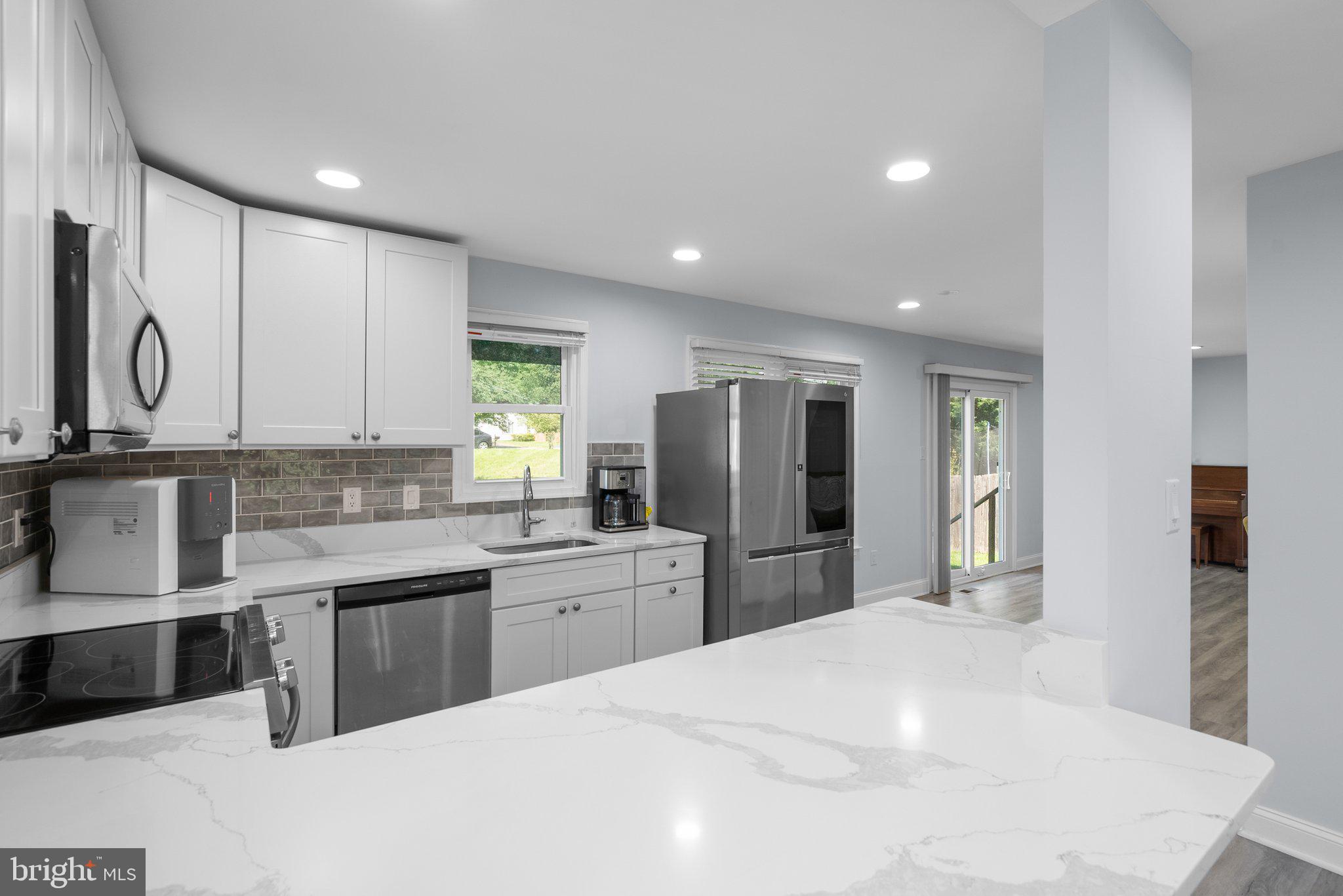 11631 Ranch Lane North Potomac, MD 20878 - Photo 11 of 32 a kitchen with stainless steel appliances a sink stove and refrigerator