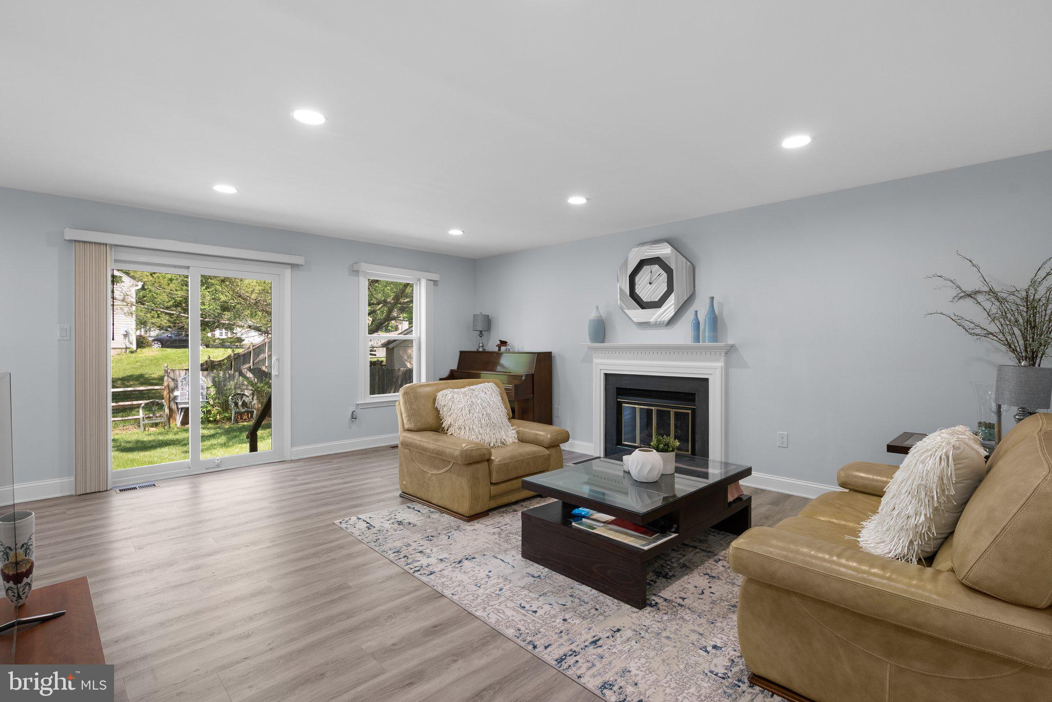 11631 Ranch Lane North Potomac, MD 20878 - Photo 14 of 32 a living room with furniture and a fireplace