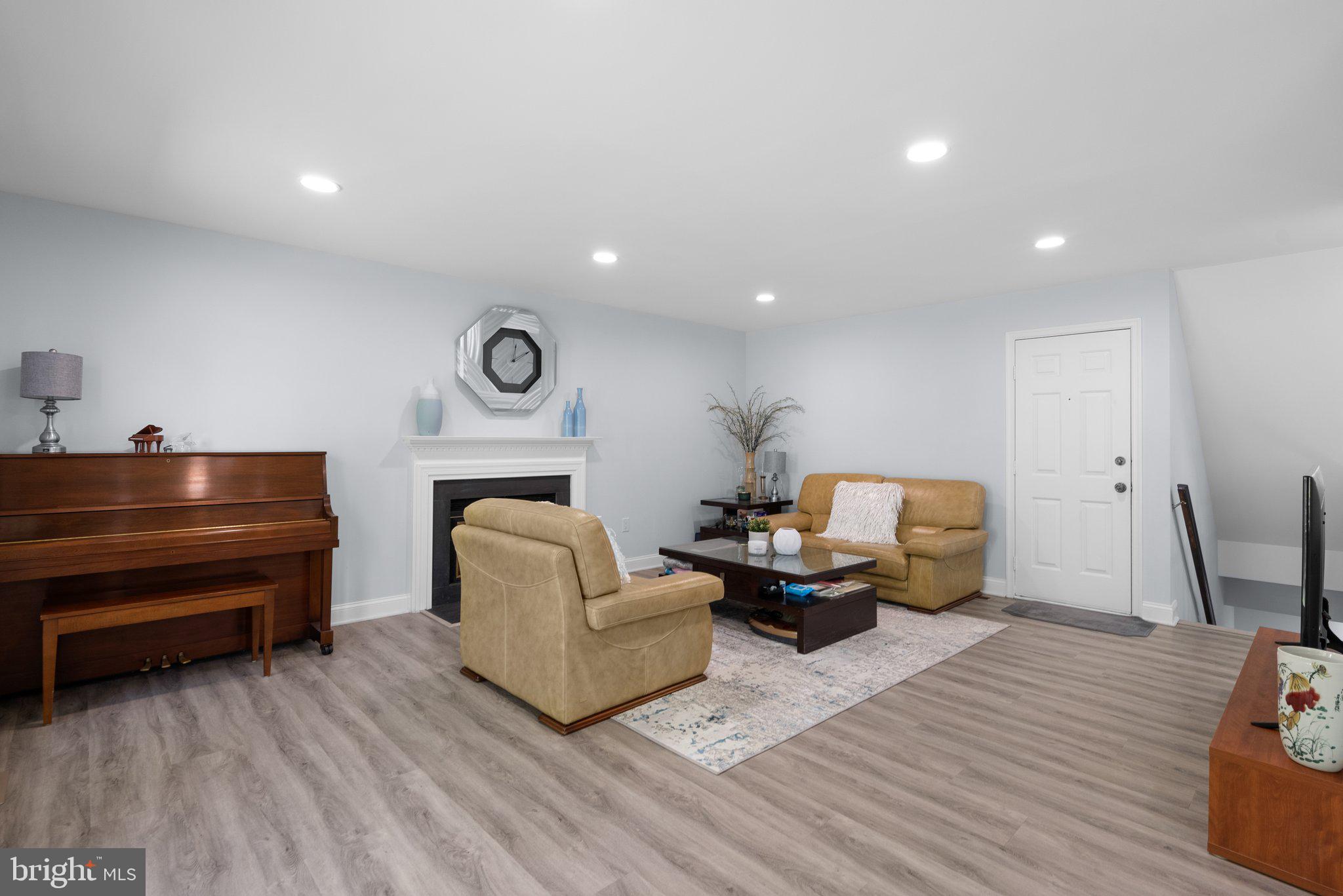 11631 Ranch Lane North Potomac, MD 20878 - Photo 15 of 32 a living room with furniture and a wooden floor