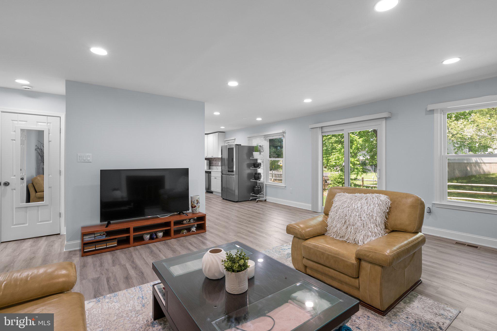 11631 Ranch Lane North Potomac, MD 20878 - Photo 16 of 32 a living room with furniture and a flat screen tv