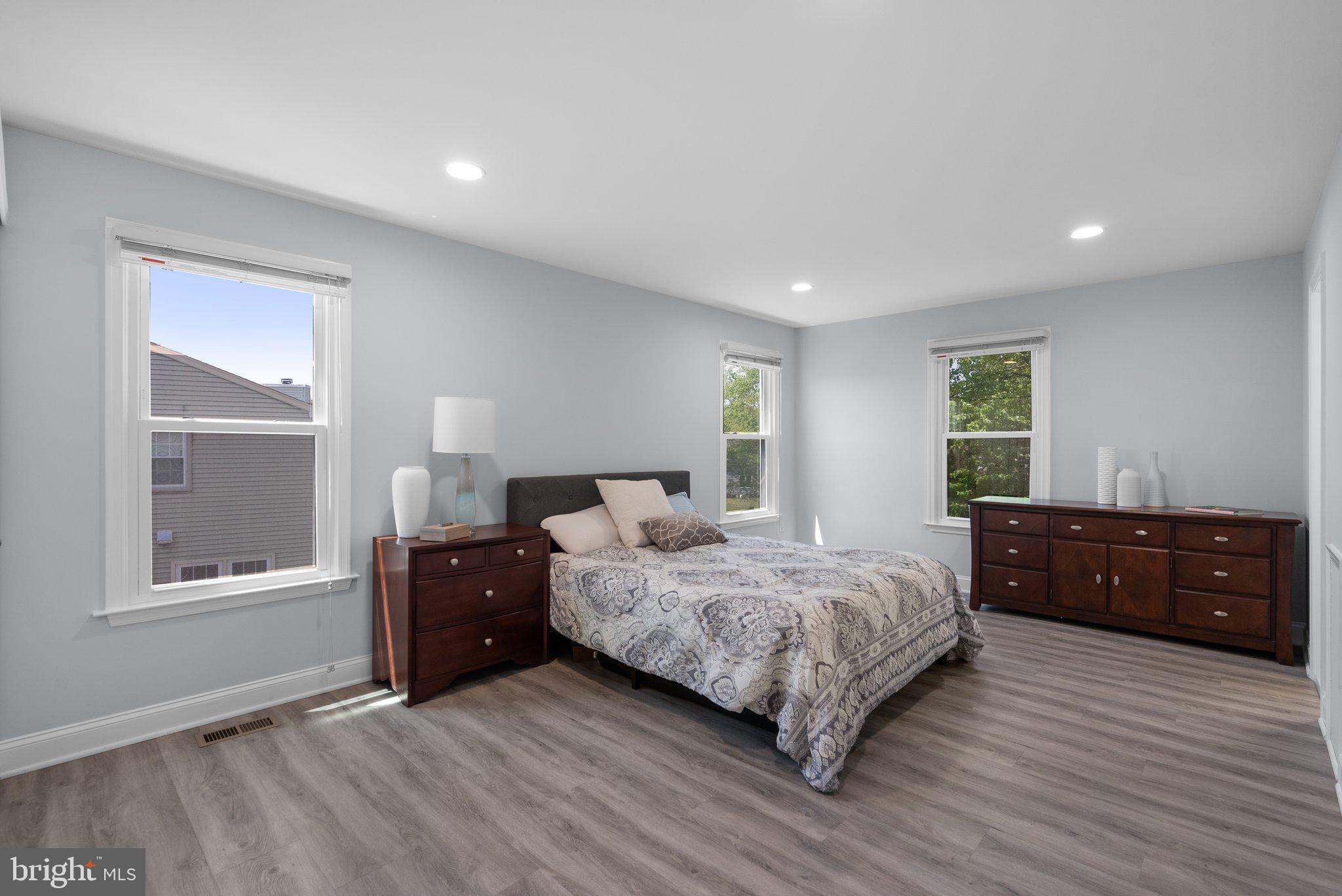 11631 Ranch Lane North Potomac, MD 20878 - Photo 19 of 32 a bedroom with a bed and wooden floor
